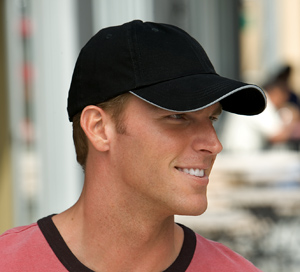 Premium cap with reflective brim trim and tightening strap for safety.